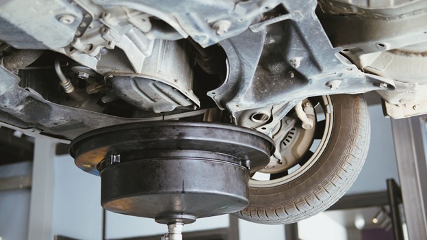 A car is lifted with morn hydraulic lift