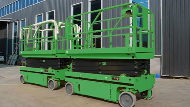 Morn Electric scissor lift parked at warehouse