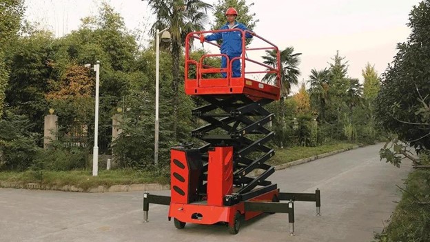 person standing on Morn Scissor lift